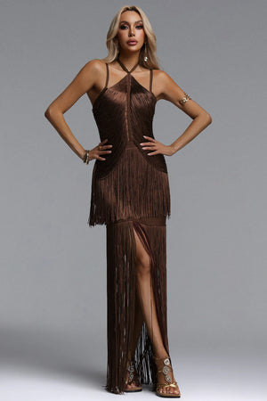 Woman wearing a brown fringe dress against a gray background