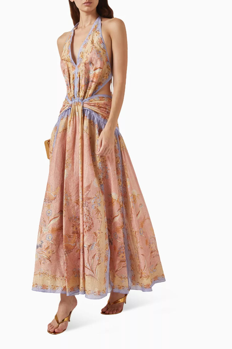 Woman wearing a floral patterned dress on a white background
