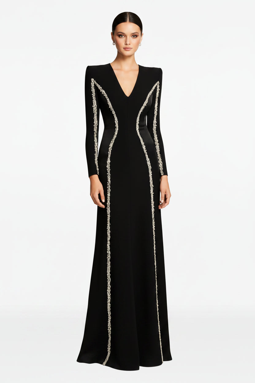Black evening gown with silver embellishments on a white background