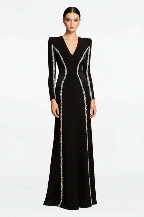 Black evening gown with silver embellishments on a white background