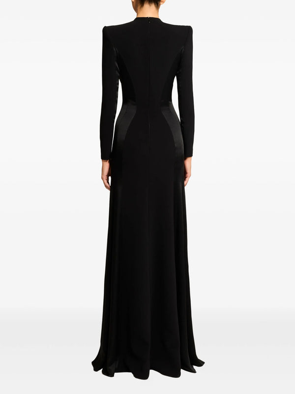 Black evening gown with long sleeves on a white background