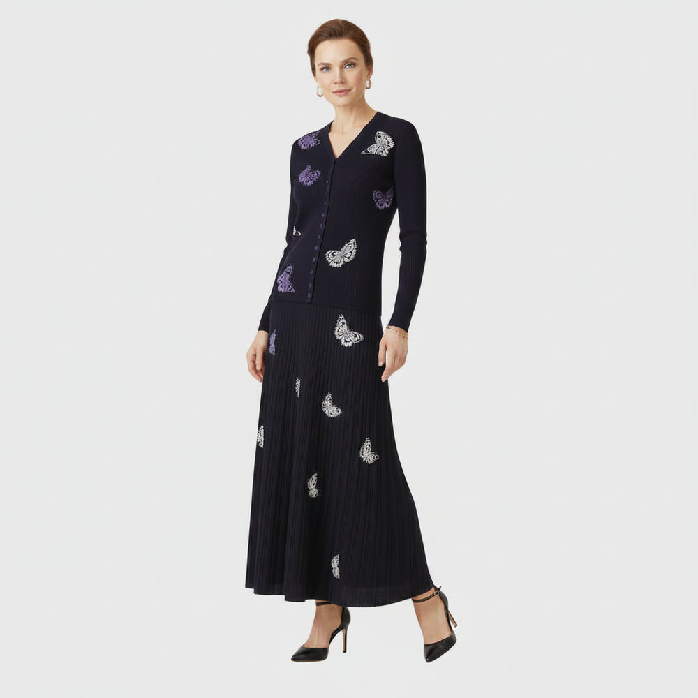 Black dress with purple floral embroidery on a white background