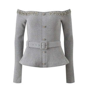Gray peplum jacket with embellishments on shoulders and belt buckle on a white background