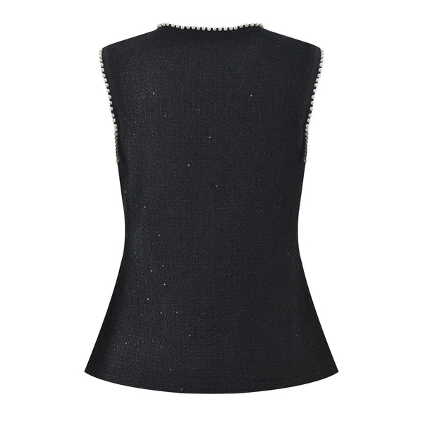 Black sleeveless top with textured trim on a white background
