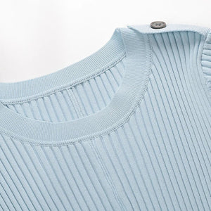 Light blue ribbed sweater collar with buttons on a light gray background