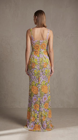 Woman wearing a floral dress with a neutral background