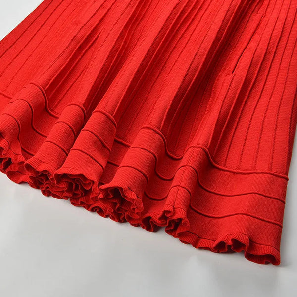Red pleated fabric on a white background