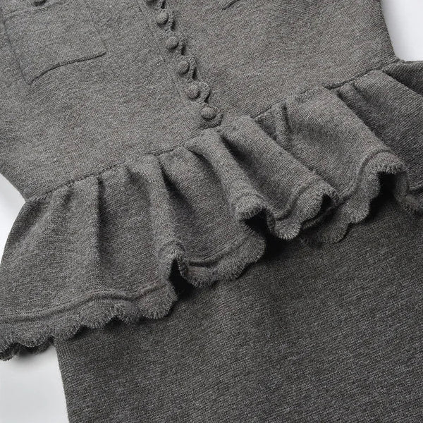 Gray dress with ruffled trim on a white background