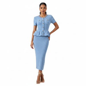 Light blue dress with peplum top and skirt on a white background