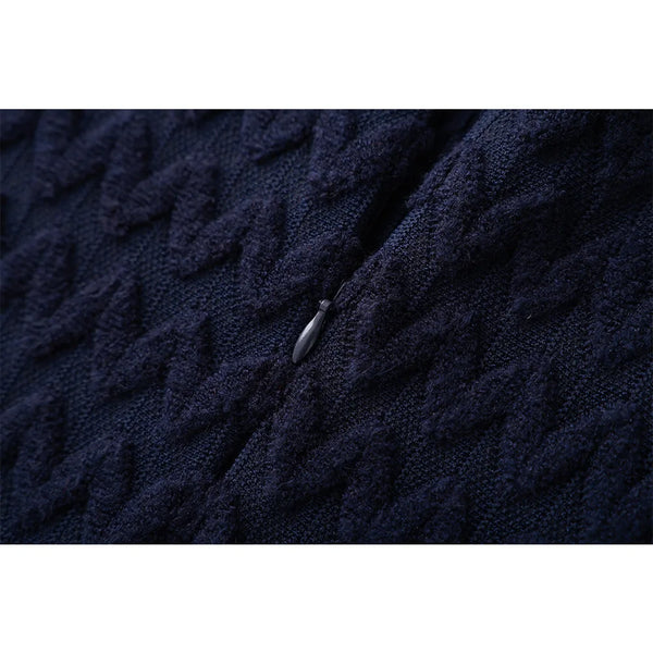 Close-up of dark blue textured fabric with a zipper