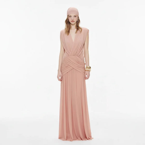 Woman wearing a pink evening gown on a white background