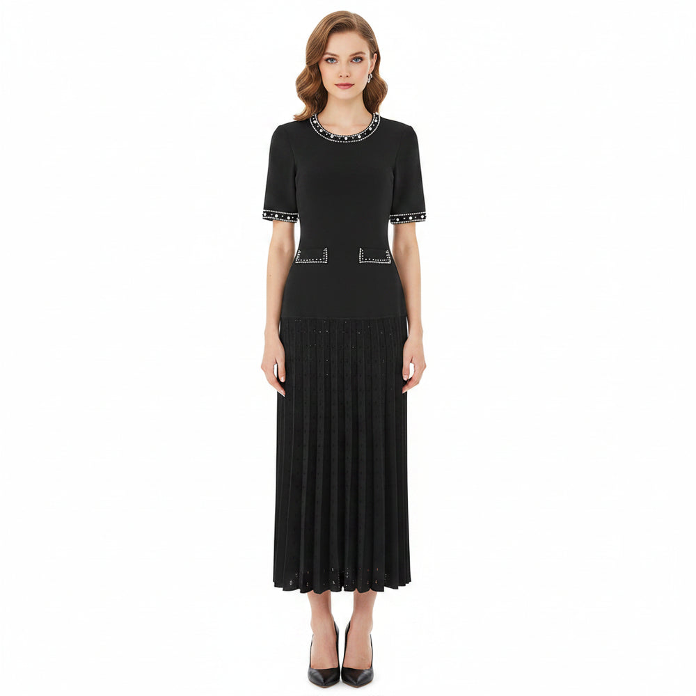 Black dress with decorative elements on a white background