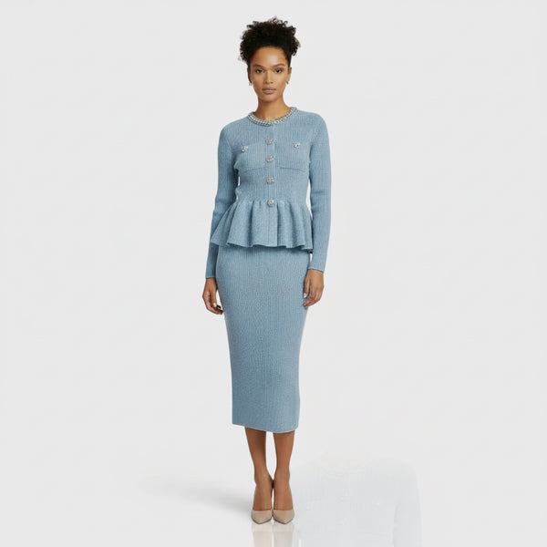 Light blue ribbed sweater with decorative buttons and matching skirt on a white background