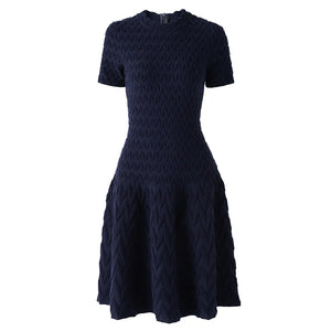 Navy blue patterned dress on a white background