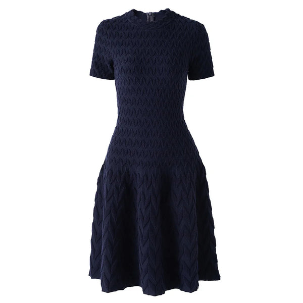 Navy blue patterned dress on a white background