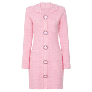 Pink coat with decorative buttons on a white background