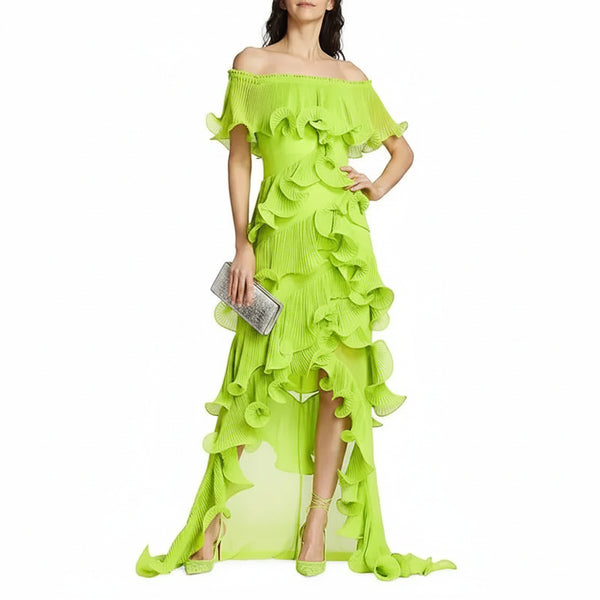 Woman wearing a bright green off-shoulder ruffled dress on a white background