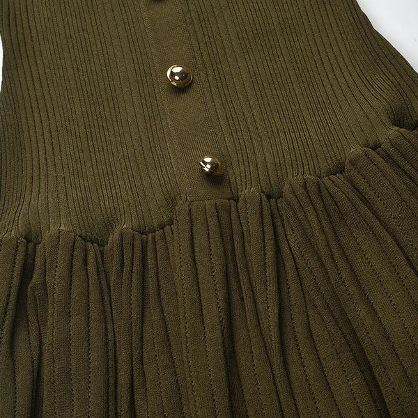 Green ribbed dress with gold buttons on a white background