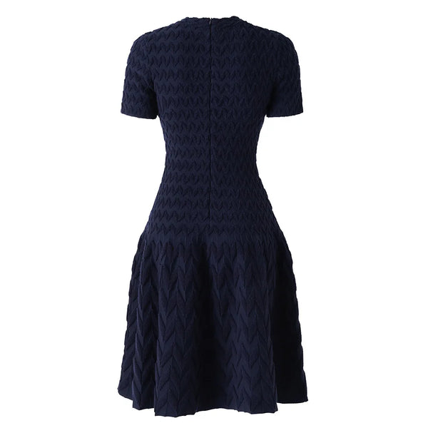 Navy blue dress with a geometric pattern on a white background