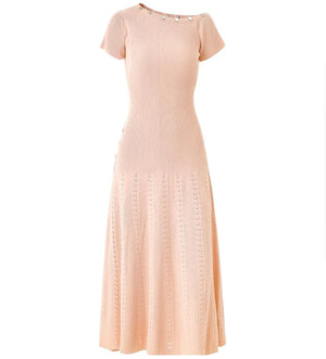 Pink ribbed dress on a white background