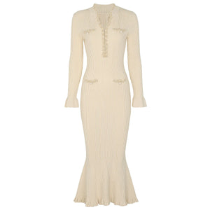 Beige ribbed dress with long sleeves on a white background