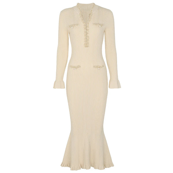 Beige ribbed dress with long sleeves on a white background