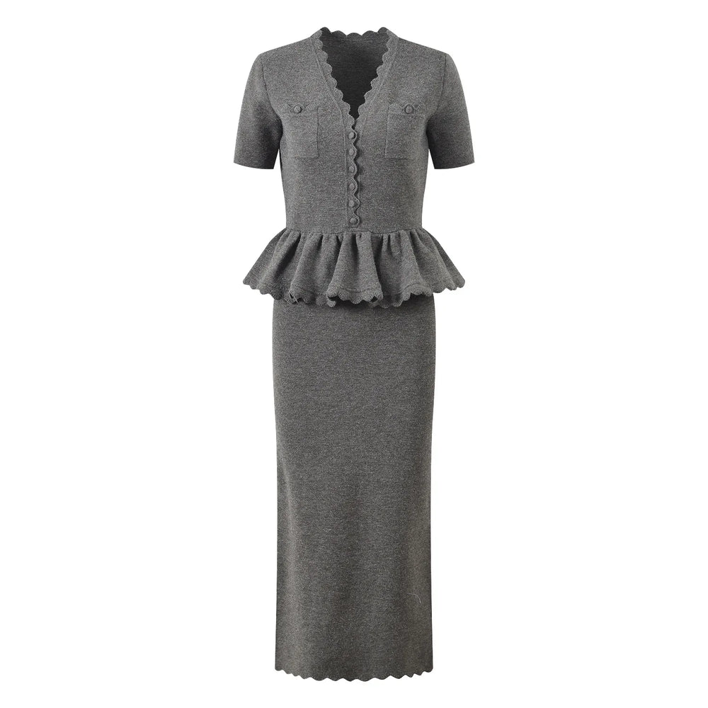Gray dress with peplum detail on a white background