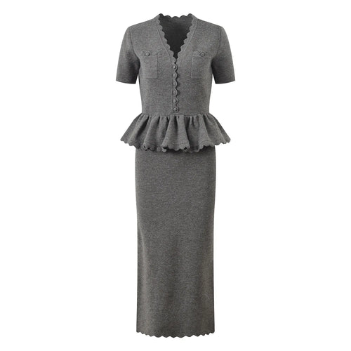 Gray dress with peplum detail on a white background