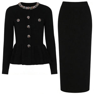 Black jacket with decorative buttons and a black pencil skirt on a white background