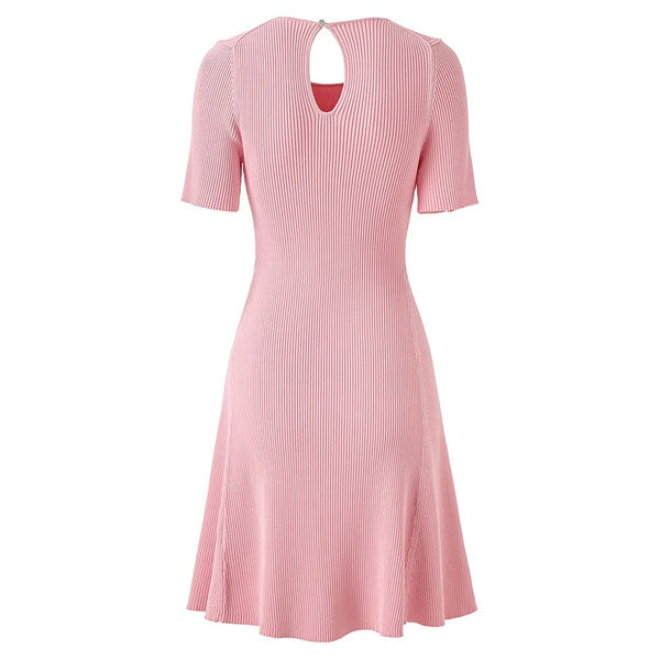 Pink ribbed dress with a cutout neckline on a white background