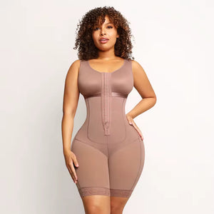 A woman modeling a sleeveless, mid-thigh body shaper in a dusty mauve-brown color, standing against a plain light background.