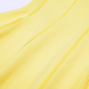 Close-up of yellow fabric with a subtle pattern
