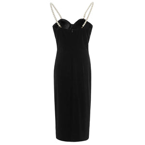 Black dress with chain straps on a white background
