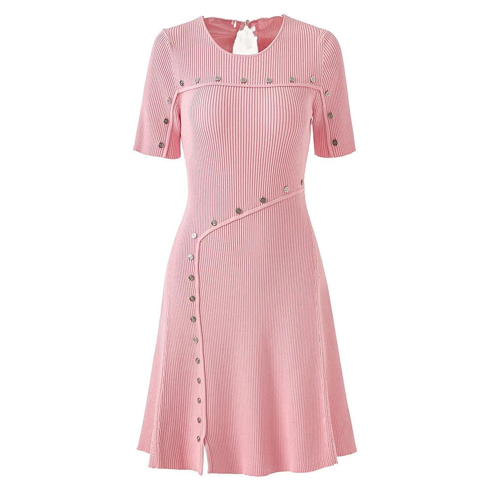 Pink dress with button details on a white background