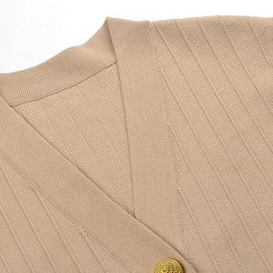 Close-up of a beige textured fabric with a button on a white background