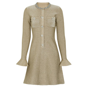 Beige dress with embellishments on a white background