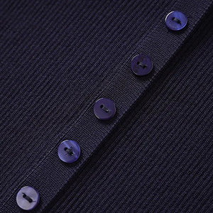 Close-up of a dark blue textured fabric with buttons