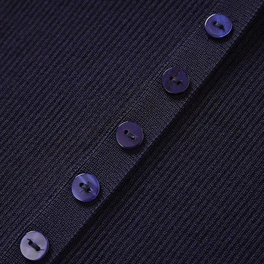 Close-up of a dark blue textured fabric with buttons