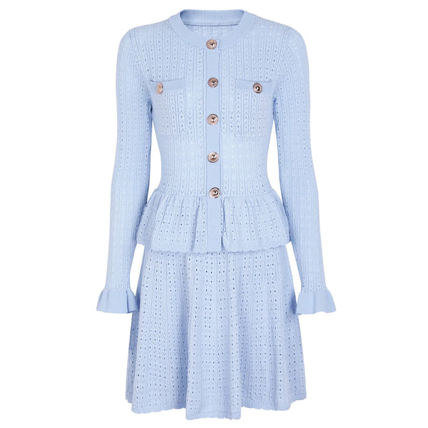 Light blue dress with button details on a white background