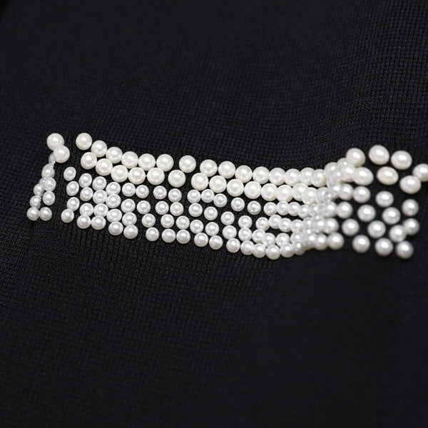 Pearl embellished design on a black background
