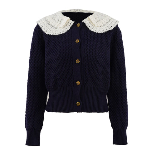 Navy blue cardigan with white lace collar on a white background