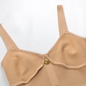 Beige bra with a gold clasp on a white background