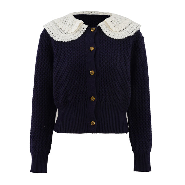 Navy blue cardigan with white lace collar on a white background