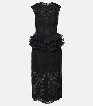 Black lace dress with peplum detail on a white background