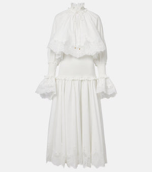White dress with ruffled sleeves on a light gray background