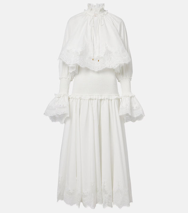 White dress with ruffled sleeves on a light gray background