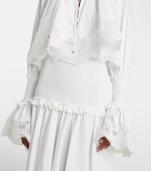 White lace dress with ruffled details on a white background