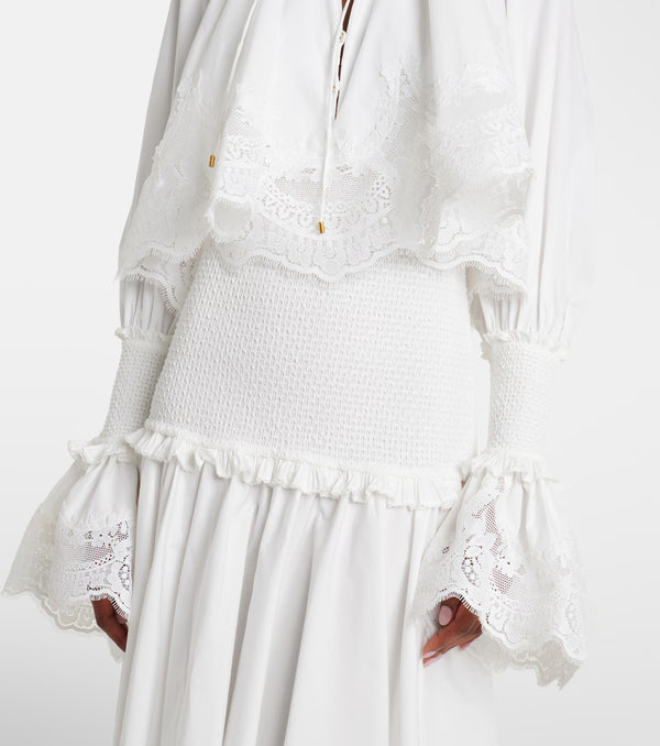 White lace dress with ruffled details on a white background