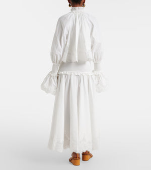 White outfit with long sleeves and a skirt on a white background