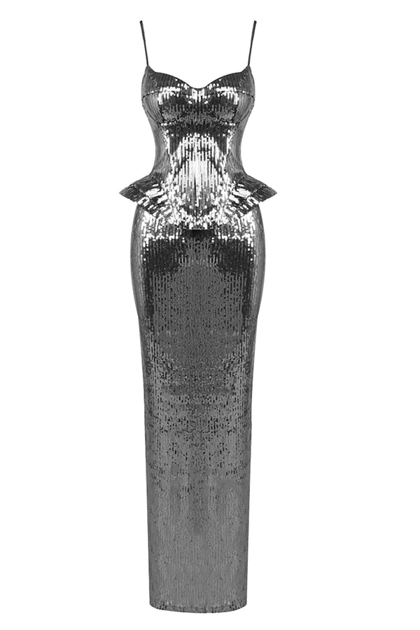 A floor-length silver sequin gown with thin spaghetti straps, a sweetheart neckline, and structured peplum waist details, shown against a plain white background.